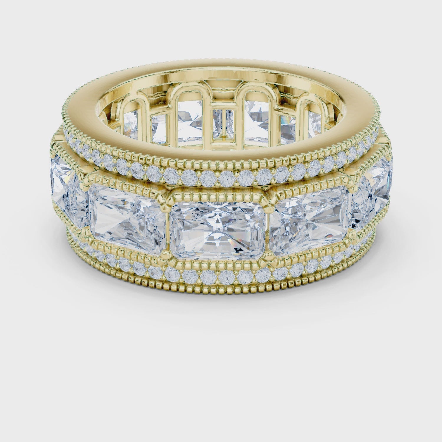 Video of yellow gold eternity band stack highlighting radiant and princess cut bands with pavé milgrain border