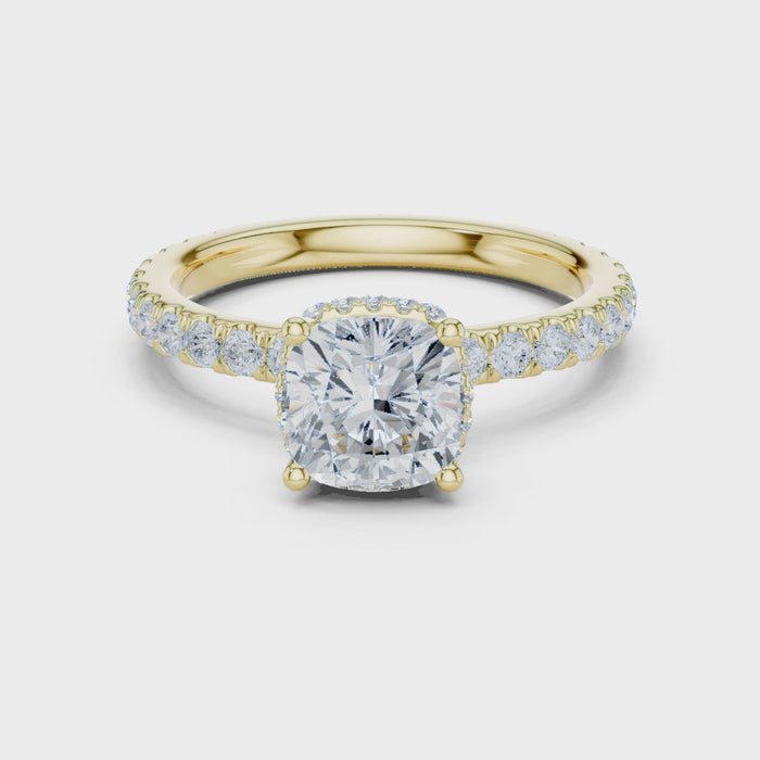 Video of cushion cut hidden halo ring with pave diamond band in yellow gold
