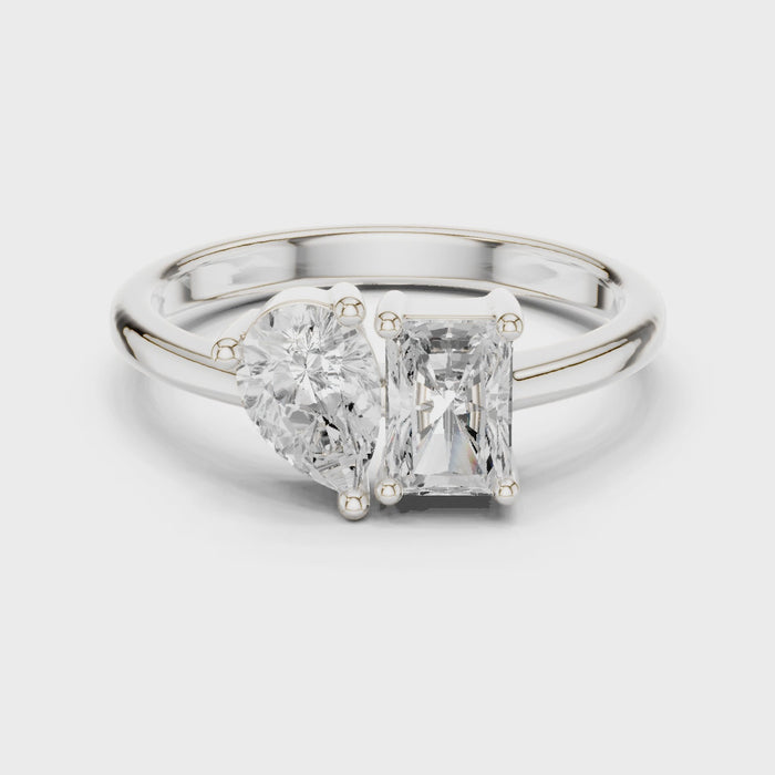 Video of white gold Toi et Moi ring highlighting pear and radiant diamond setting