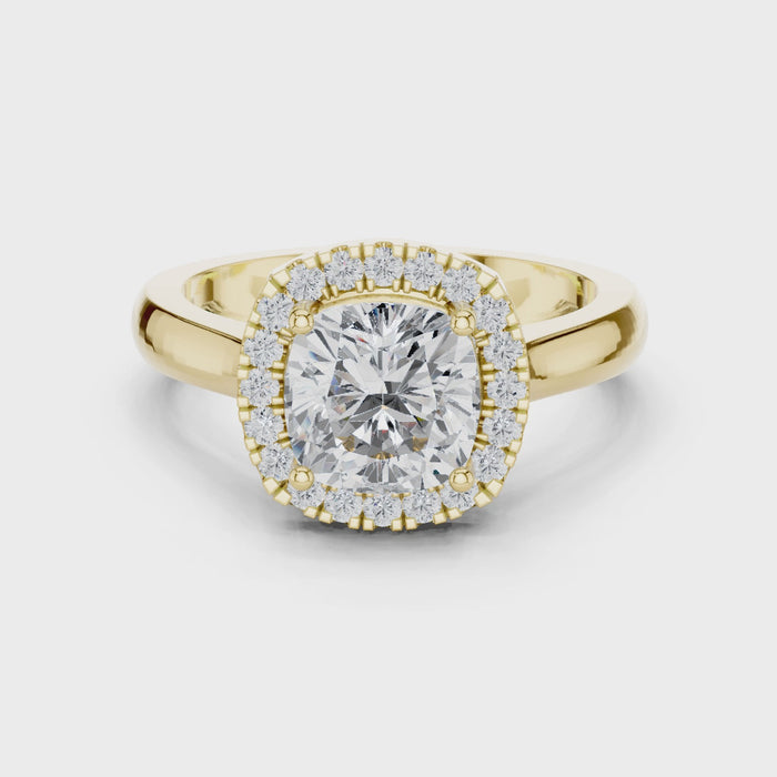 Video of yellow gold cushion halo ring highlighting diamond setting and structure