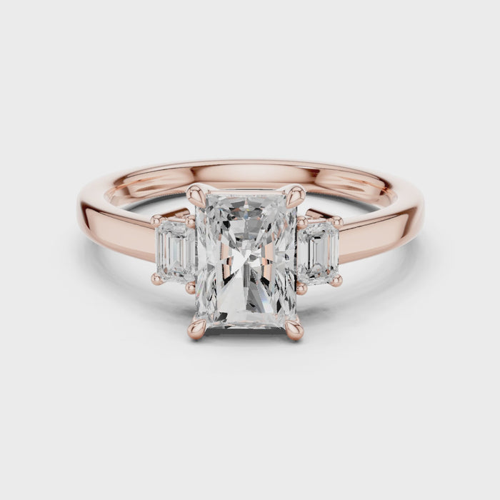 Radiant three stone engagement ring with emerald cut side stones in rose gold, lab grown diamond, Video, Australia DFE