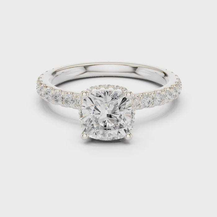 Video view of cushion cut hidden halo ring with pave diamond band in white gold