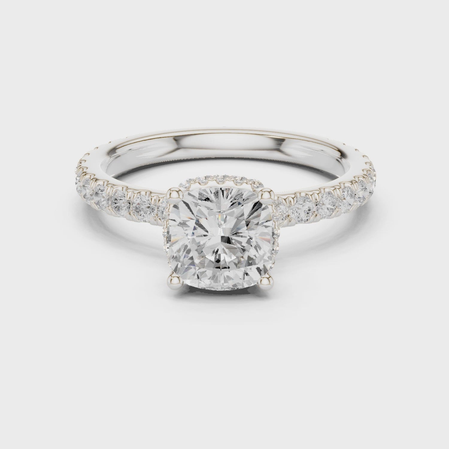 Video view of cushion cut hidden halo ring with pave diamond band in white gold