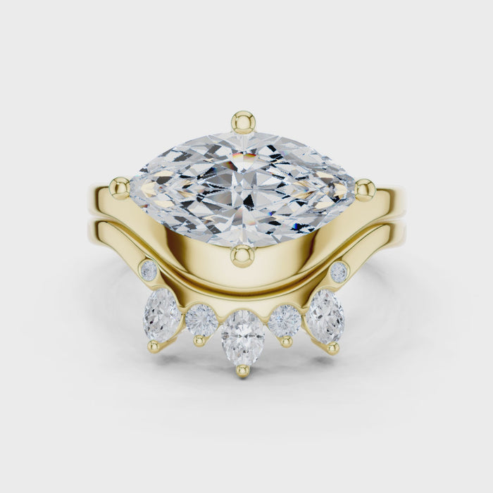 Video of yellow gold marquise solitaire ring with crown tiara band highlighting elegant structure