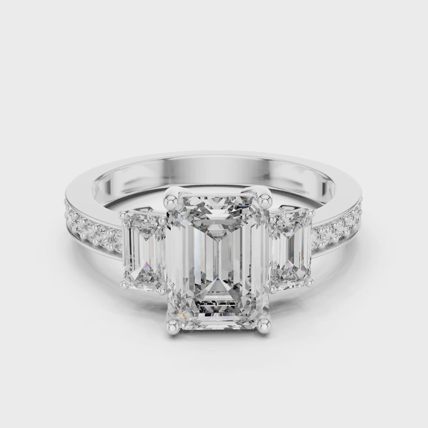 Emerald Cut Three-Stone Diamond Ring with Pavé Band