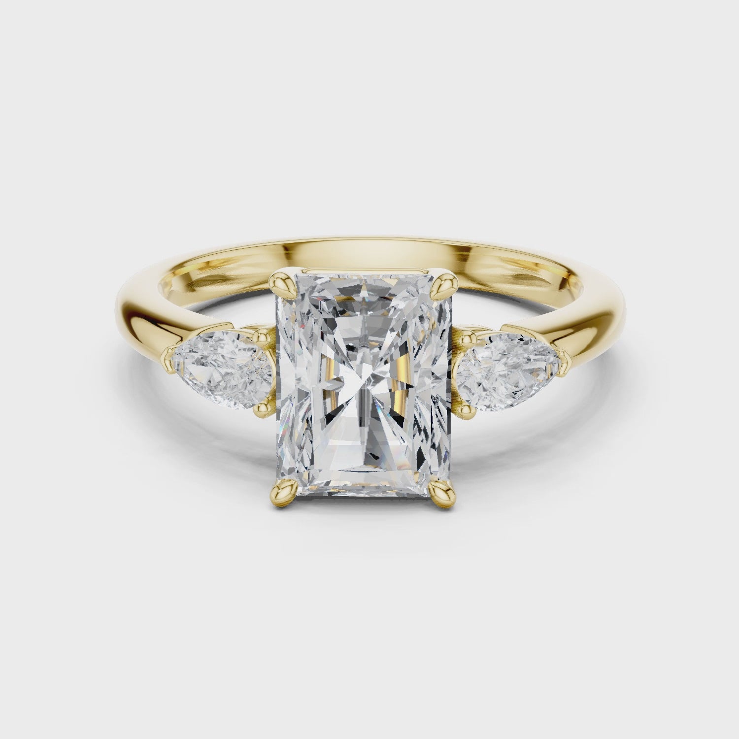 Clarion Radiant Emerald Three-Stone Diamond Ring