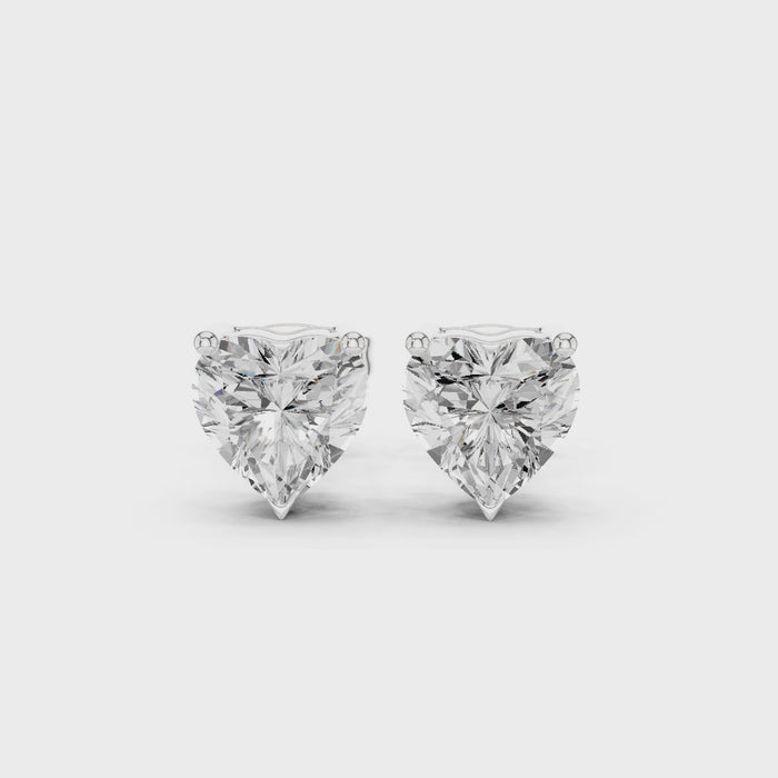 Video of heart cut Diamond stud earring on a white background with side view