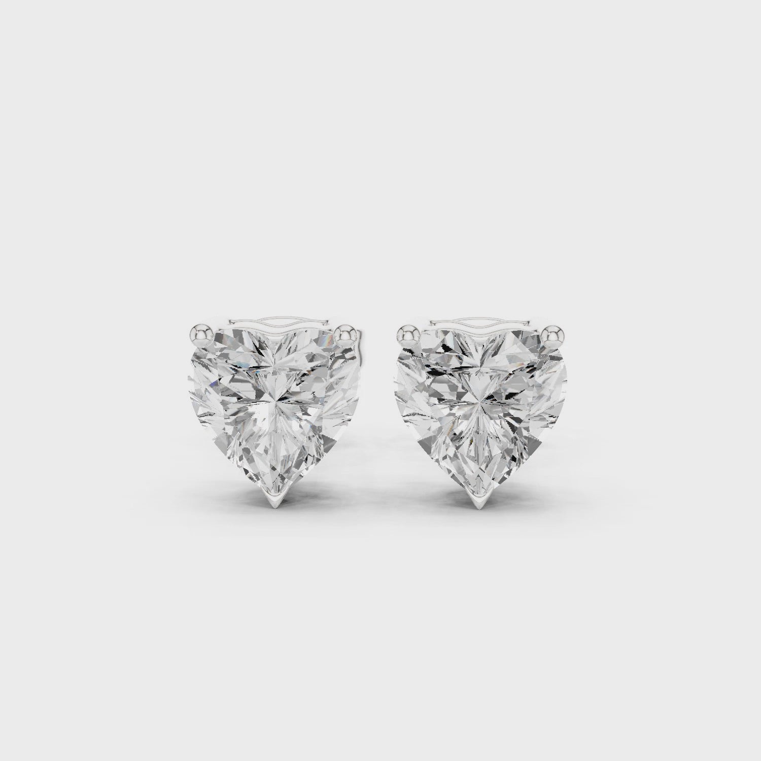 Video of heart cut Diamond stud earring on a white background with side view