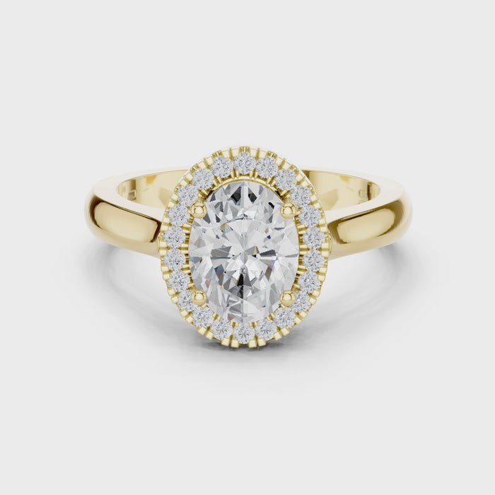 Video of yellow gold oval halo ring highlighting diamond setting and structure