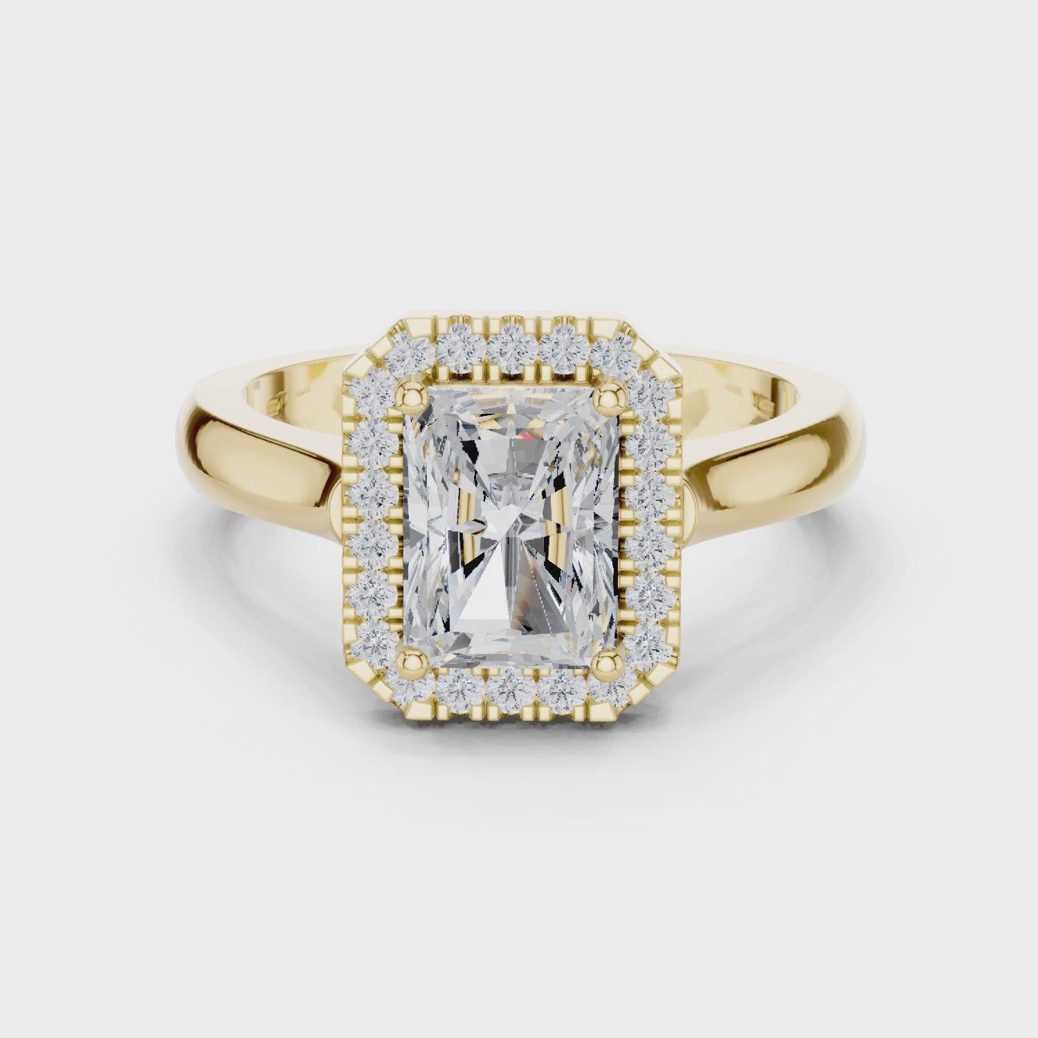 Video of yellow gold radiant halo ring highlighting diamond setting and structure