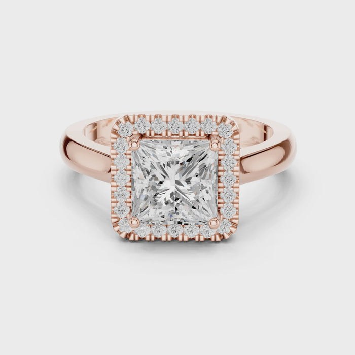 Video of rose gold princess halo ring highlighting diamond setting and band profile