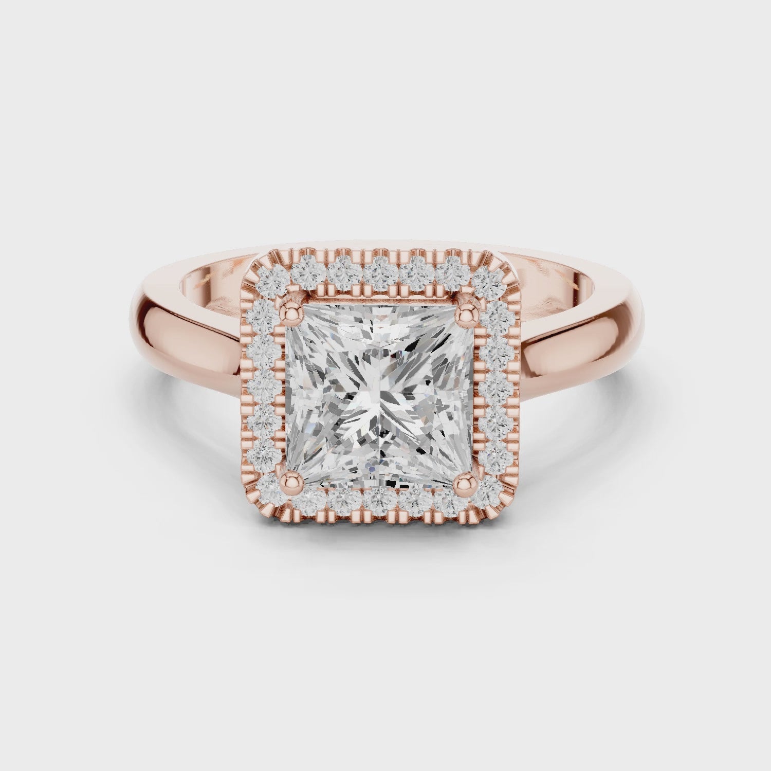 Video of rose gold princess halo ring highlighting diamond setting and band profile