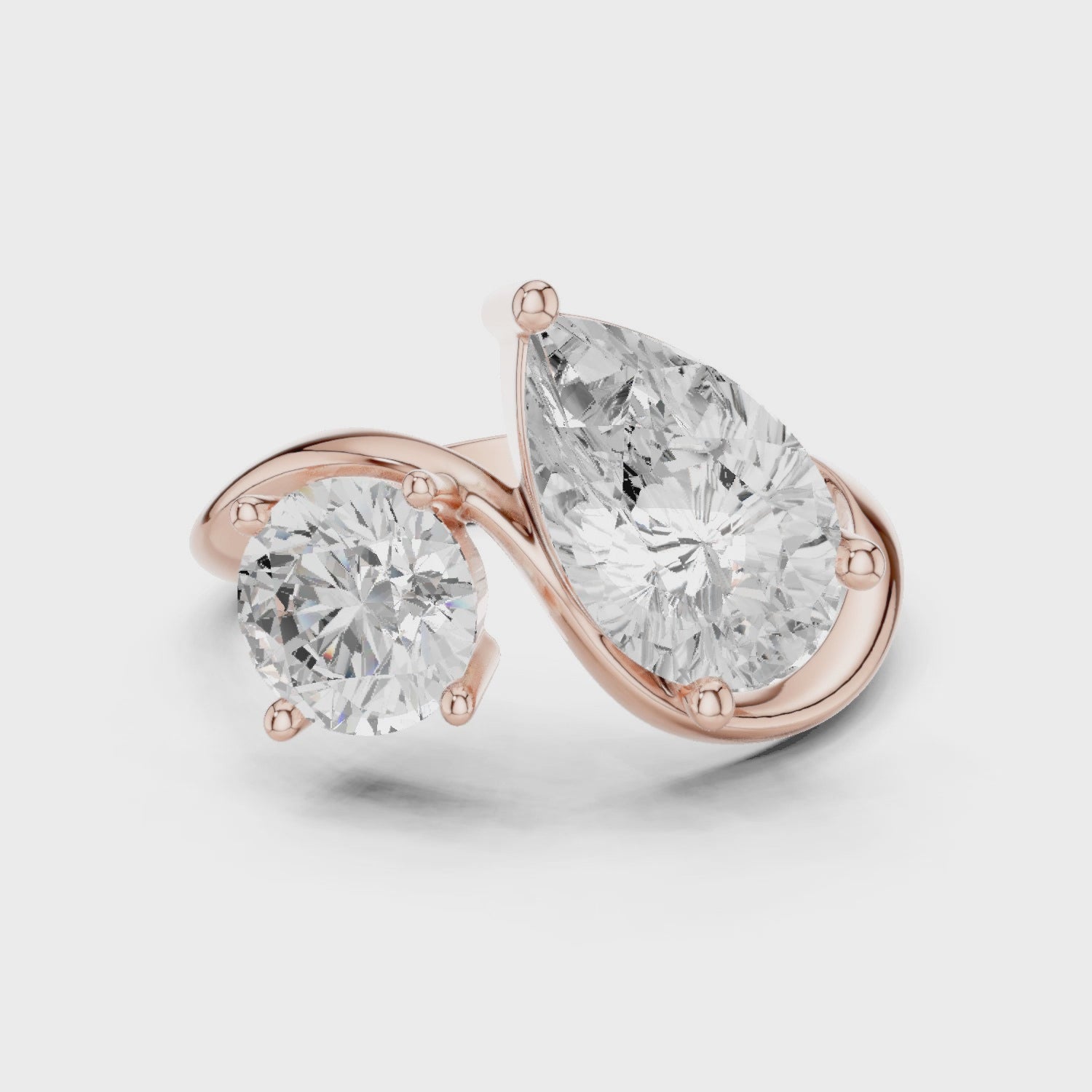 Rose gold round and pear lab diamond bypass ring