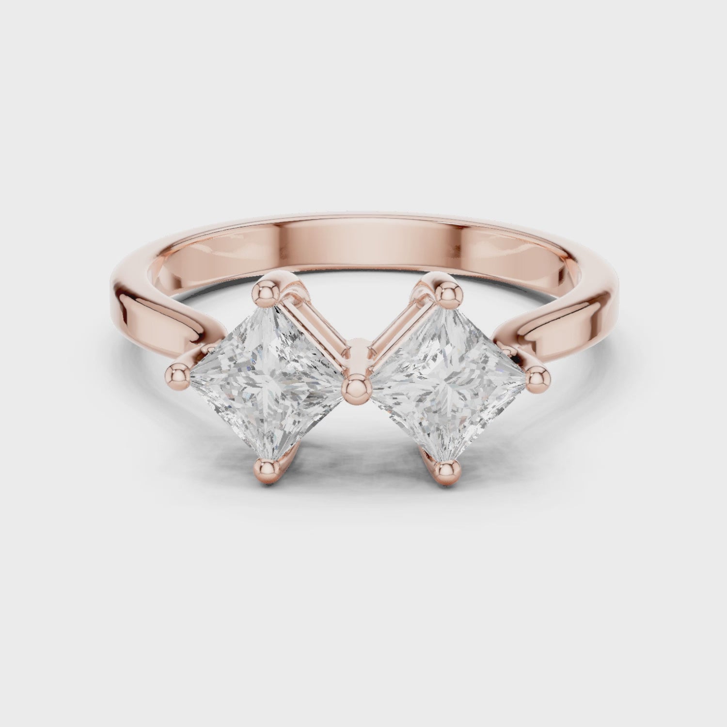 Video of rose gold Toi et Moi ring highlighting double princess diamond setting
