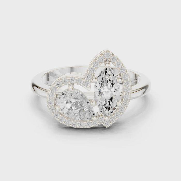 Video of white gold Toi et Moi ring highlighting marquise and pear diamonds, pavé halo and split shank structure