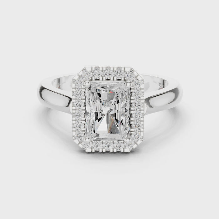 Video of white gold radiant halo ring highlighting diamond setting and band profile