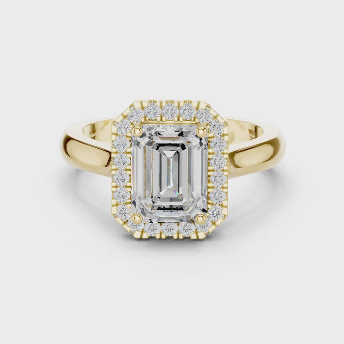 Video of Emerald cut halo ring with lab-grown diamond in yellow gold, elegant and classic design