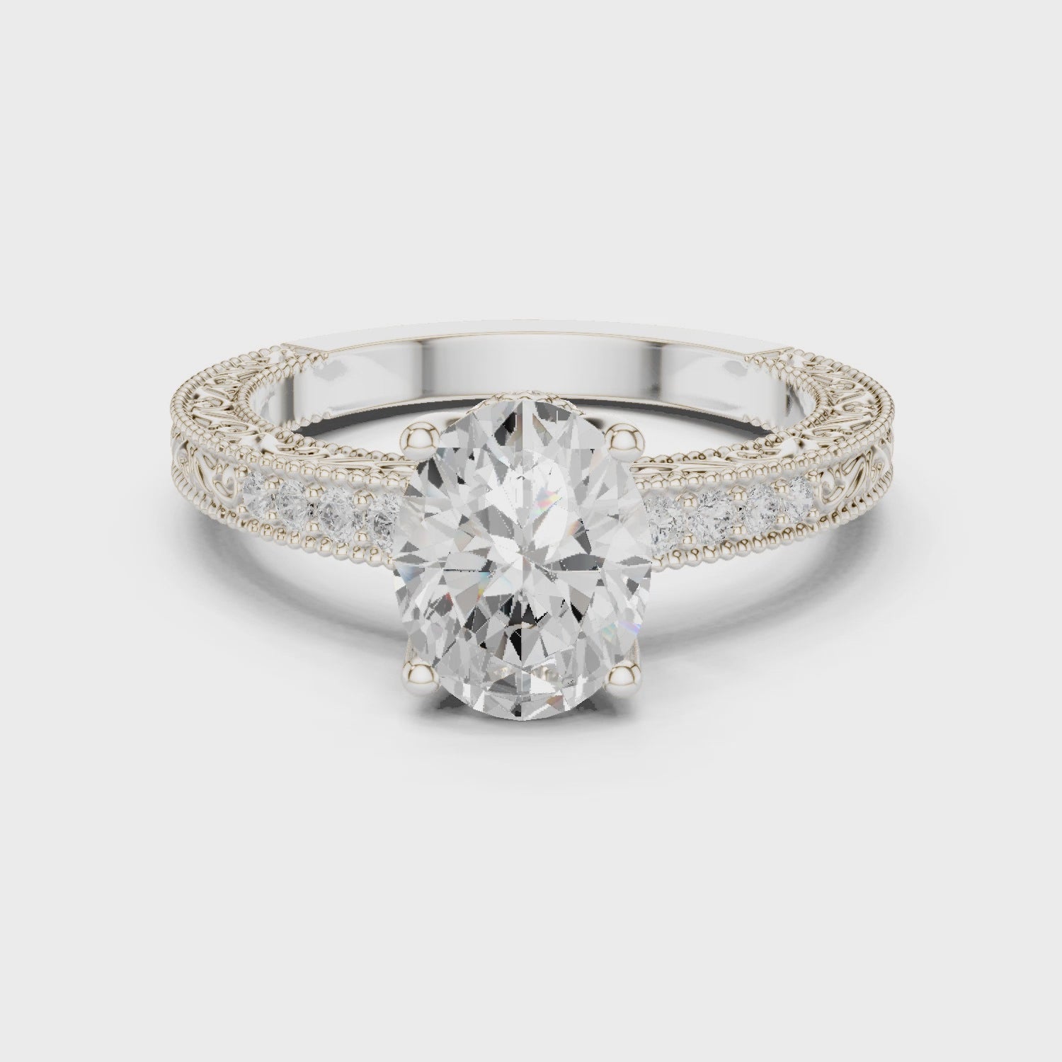 Side view of oval vintage filigree white gold ring with milgrain detailing and channel-set diamond band in video