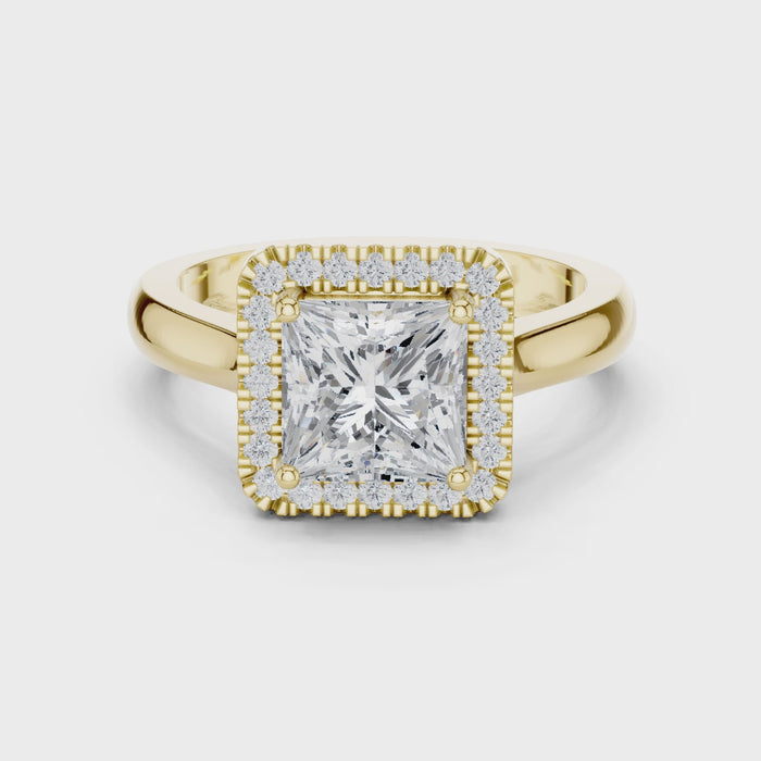 Video of yellow gold princess halo ring highlighting diamond setting and structure