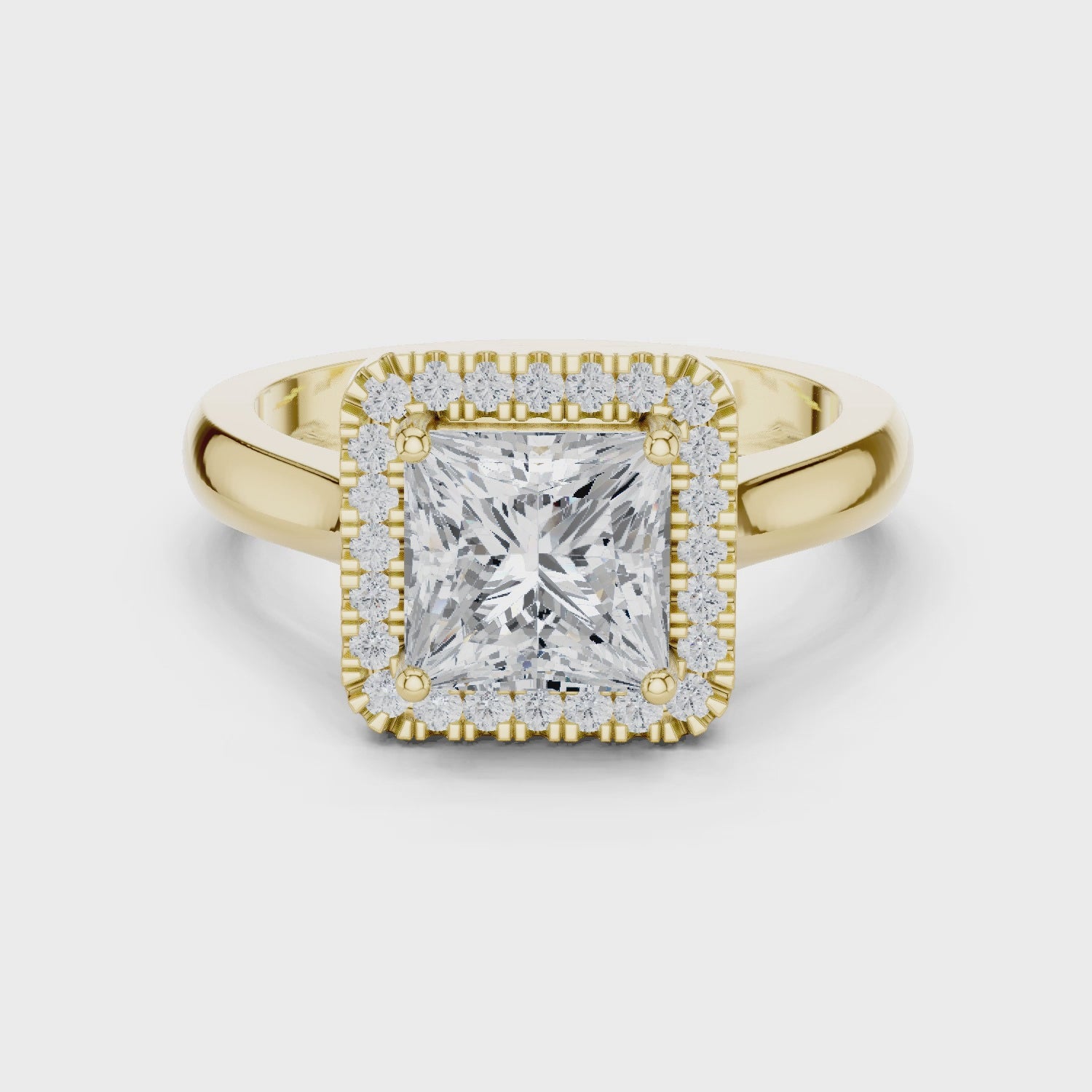 Video of yellow gold princess halo ring highlighting diamond setting and structure