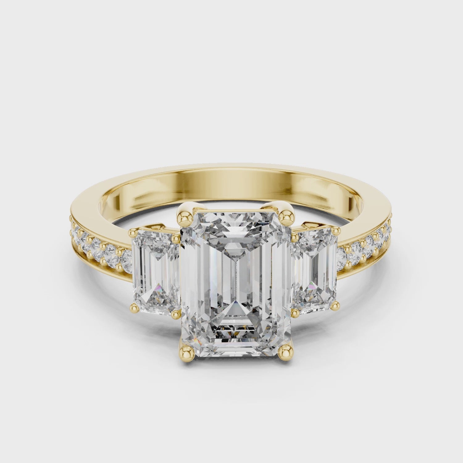 Emerald Cut Three-Stone Diamond Ring with Pavé Band