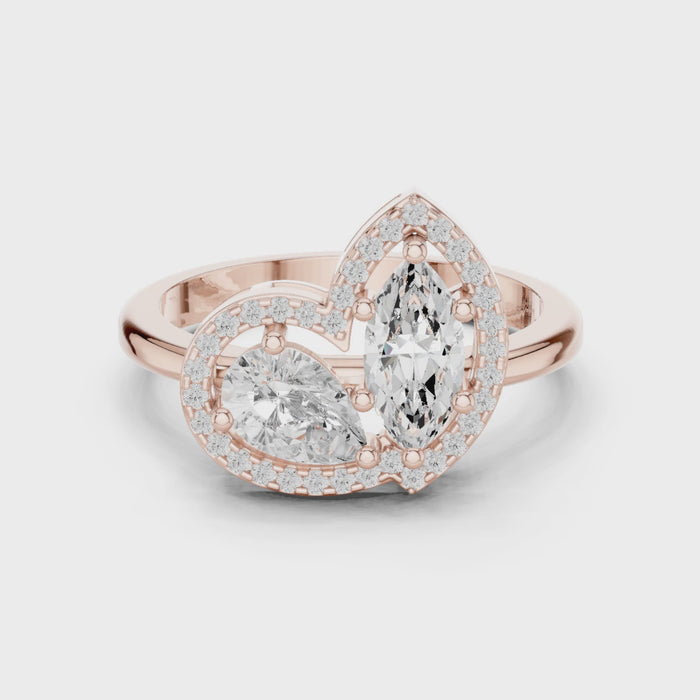 Video of rose gold Toi et Moi ring highlighting marquise and pear diamonds with pavé halo and split shank
